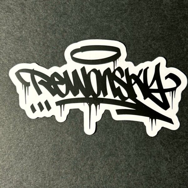 rewonsky tag sticker in black and white close up photography